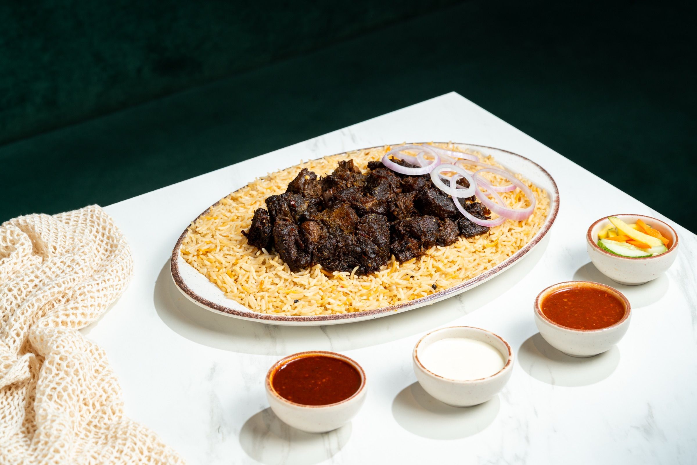Black Beef Mandi with rice and sliced onions