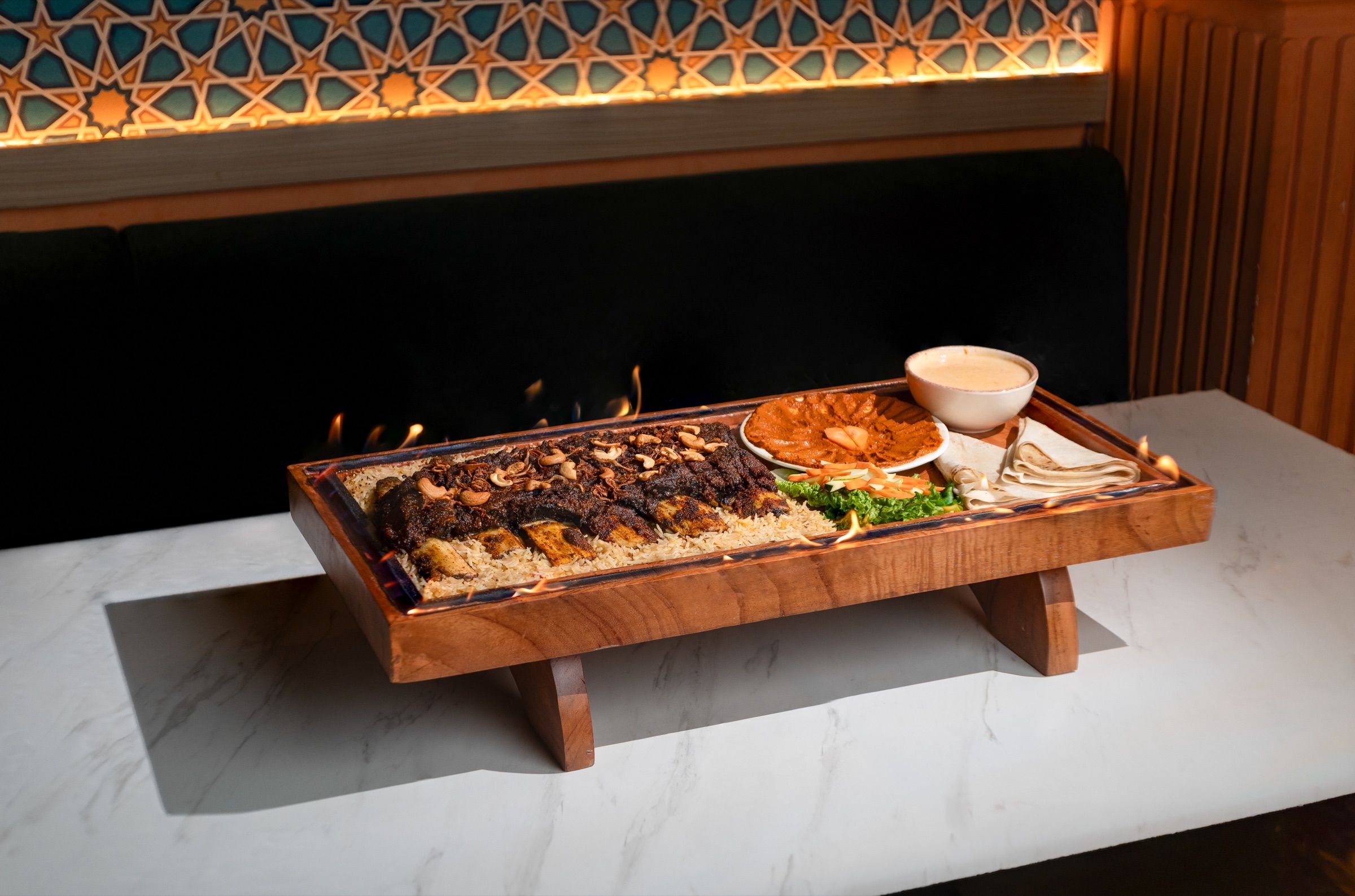 Laham Mashwi served with rice and house sauces